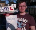 Luke with Driving test pass certificate