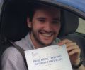 Davi with Driving test pass certificate