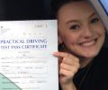 Emma with Driving test pass certificate