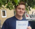 Adam with Driving test pass certificate