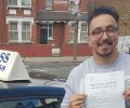 Ayhan with Driving test pass certificate
