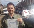 Craig with Driving test pass certificate
