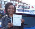Afua with Driving test pass certificate