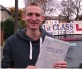 Matthew with Driving test pass certificate