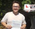 Bradley with Driving test pass certificate